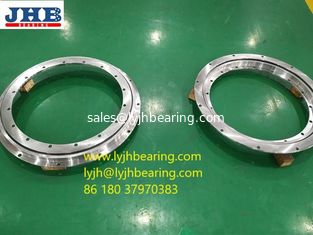 China VLU 200414 slewing bearing with flange 518x304x56mm for access platforms supplier