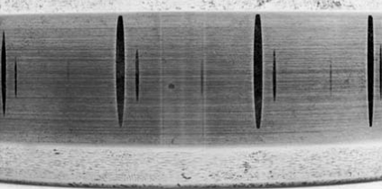 shows pseudo-indentations on the inner ring of a cylindrical roller bearing, distributed according to the rolling element spacing. .png shows pseudo-indentations on the inner ring of a cylindrical roller bearing, distributed according to the rolling element spacing. .png